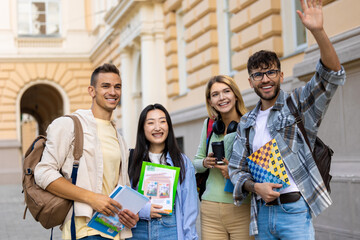 Multicultural group of college students or friends standing in campus.