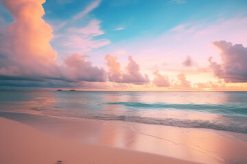Fototapeta na wymiar A sunset on a beautiful beach over blue sky and ocean.