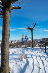 view from Petersberg mountain over the snow covered roofs of Erfurt
