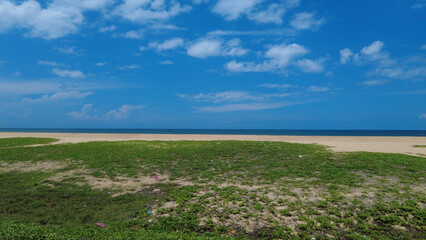 Fototapeta na wymiar Poovar golden sand beach, bright blue sky, Thiruvananthapuram, Kerala, seascape view 