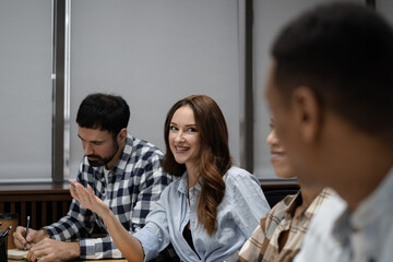 Young creative coworkers working with new startup project in office.