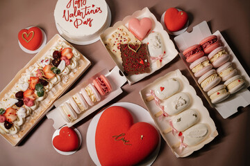 set of Valentine's day desserts with macaroons, ice cream and heart-shaped cakes
