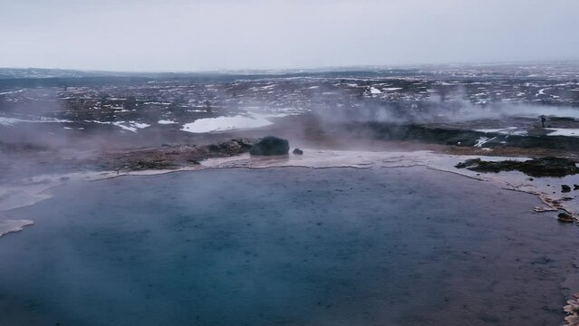 Impressive view of Icelands Geysir Geisir in the Golden Circule, the geothermal activity and a attraction for tourists in Iceland