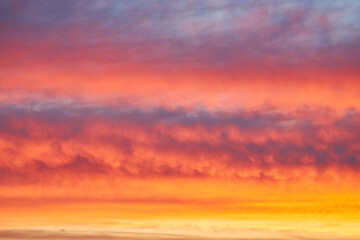 Sunset sky, clouds painted in bright colors over Kyiv