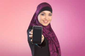 A Saudi arab character woman holding a digital tablet