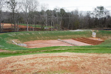 Obraz premium Newly constructed large drainage ditch in residential subdivision