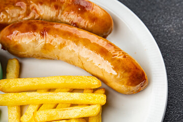 fried sausages and french fries fast food meat and potatoes tasty fresh eating cooking appetizer meal food snack on the table copy space food