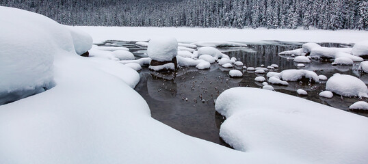 Glacier Lake Covered in Snow in Winter Time. Canadian Nature Landscape Background