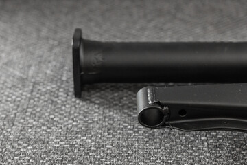 Freshly painted, powder coated, torque tube of an oldtimer car. Detail of black powder coated...
