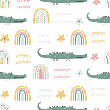 Childish vector seamless pattern with cute hand drawn crocodiles and rainbows in simple cartoon doodle style.