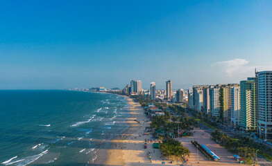 Aerial sunset view of Da Nang coastline. My Khe beach seafront with high-rise hotels and...