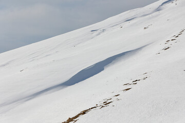 Obraz premium Hike to the snow-capped peaks of the Georgian mountains in the Ilto Nature Reserve 