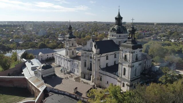 Aerial drone flyover footage of Monastery of the Bare Carmelites in Berdychiv, historic city in Zhytomyr Oblast, Ukraine.
