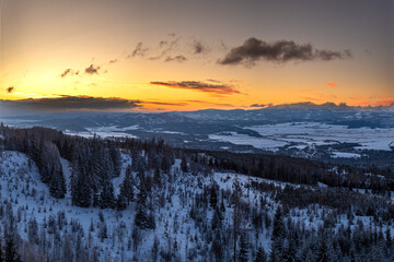 Morning fantastic orange multicolor sunrise landscape in High Tatras Slovakia during winter time