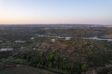 Watershed of the Odejouca and Arade rivers in South Portugal, connection of these rivers, view of the mountains and Portimao on the Atlantic Ocean