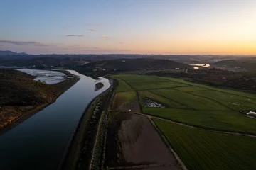 Photo sur Plexiglas Atlantic Ocean Road Watershed of the Odejouca and Arade rivers in South Portugal, connection of these rivers, view of the mountains and Portimao on the Atlantic Ocean