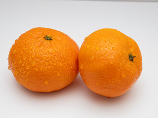 two tangerines on a white background