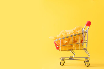 Pasta in a shopping basket as a visualization of the value of grain products.