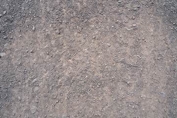 Background with gravel stones on a gravel road