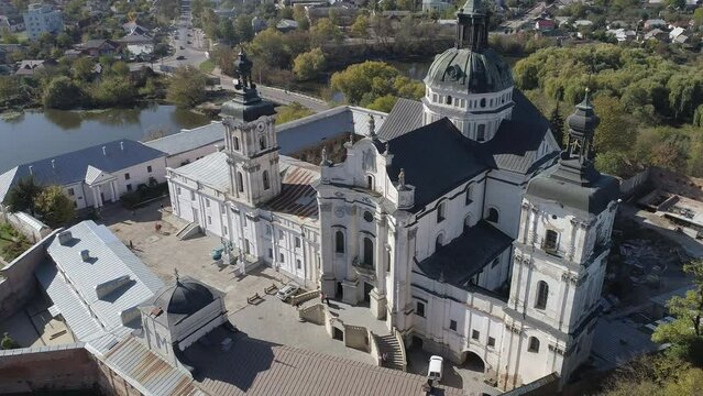 Aerial drone autumn footage of Monastery of the Bare Carmelites in Berdychiv, historic city in Zhytomyr Oblast, northern Ukraine.  Travel destinations across Ukraine