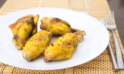 Fried chicken wings on white plate