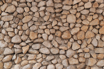 Wall of old beige stone. masonry. Stones wall background or texture. Texture laid out of stone. Old  wall background. Natural stone wall made of stones. Abstract grunge  background