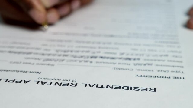 Young Black Man Filling Out Residential Rental Application
