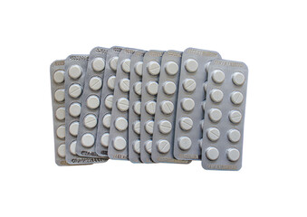 white color pills in blister packs, medicines for allergies, antibiotics, painkillers, pill packaging isolated on white background, top view