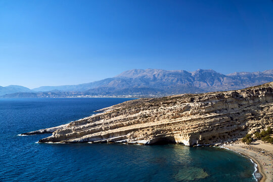 People on the sandy beach of Matala on the island of Crete