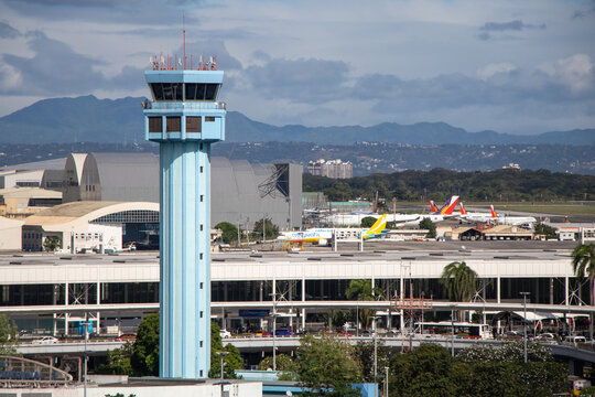 Aerial view of Air Traffic Control Tower and Terminal 2 at Ninoy Aquino International Airport - Manila, Philippines