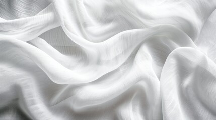 Obraz premium Lightweight white cotton fabric, perfect for crafting comfortable and breathable clothing items.