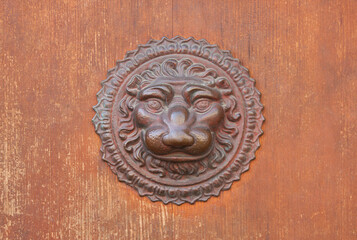 Metal door decor in shape of lion's head