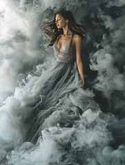 Woman Surrounded by Flowing Wispy Smoke that Forms Her Elegant Dress Concept