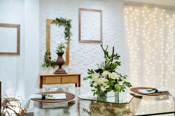 white wall with a wooden frame and flower decorations