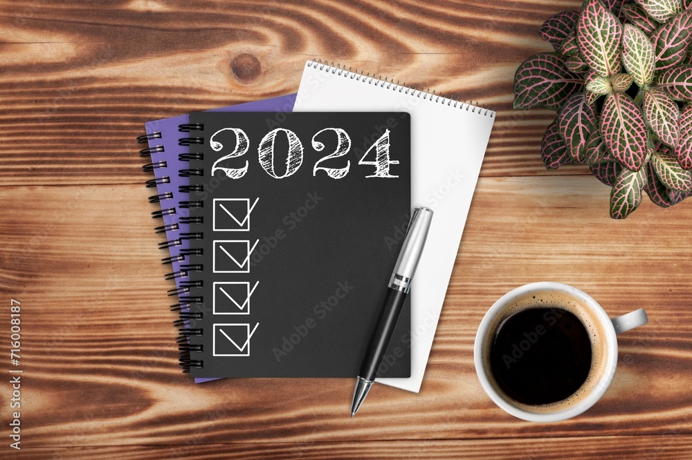 Wall mural New year 2024 resolutions on office desk.