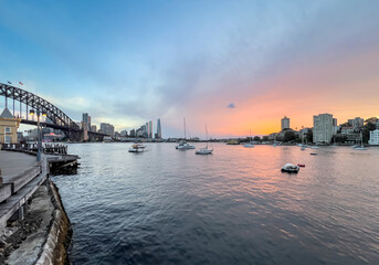 Sydney Harbour viewed from North Sydney at Sunset with Sydney City Skyline and CBD high-rise,  colourful skies NSW Australia