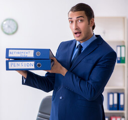 Young male accountant working in the office
