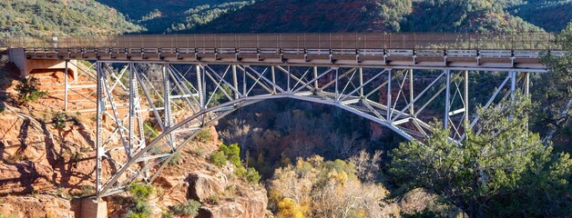 Famous Single Span Steel Arch Midgley Bridge over Wilson Canyon Ravine Panorama.  Highway 89 Sedona Arizona Southwest USA