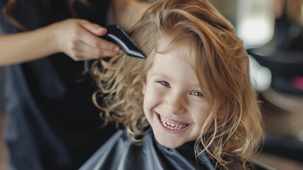 Fototapeta premium happy smiling child sitting in a chair at the hairdresser, haircut, hairstyle, style, girl, boy, kid, toddler, fashion, beauty salon, barbershop, hair, portrait, face, emotional