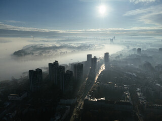Drone aerial view of Belgrade city in the smog and fog in the morning. Zemun and New Belgrade...