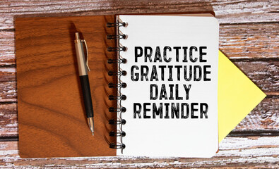 Practice gratitude daily reminder - inspirational handwriting on a napkin.
