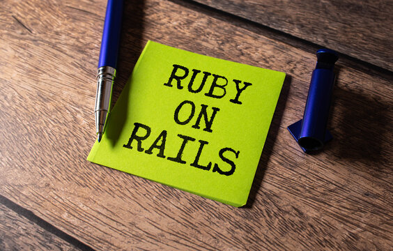 Monitor in modern office with text RUBY ON RAILS on the screen
