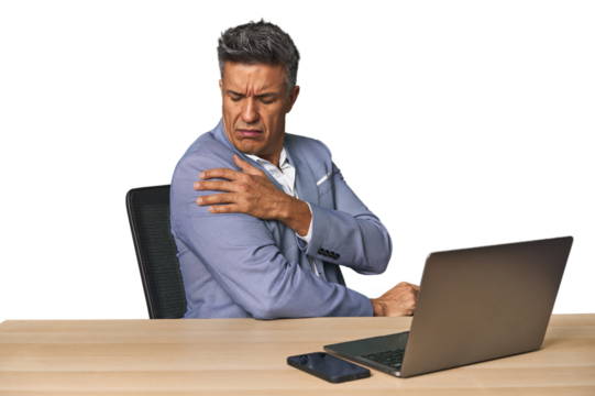 Elegant businessman at desk with laptop having a shoulder pain. - Powered by Adobe