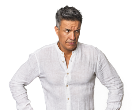 Middle-aged Latino man confused, feels doubtful and unsure.