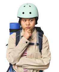 Young Chinese woman ready for hiking in studio