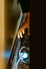 Reaching for an object that fell behind a desk