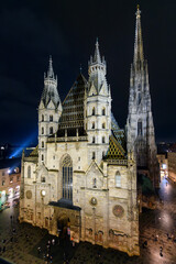 High angle night view of the gothic St. Stephen's Cathedral, the mother church of the Roman Catholic Archdiocese of Vienna, in Stephansplatz Square, Vienna Austria.