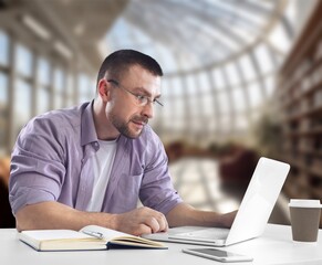 Smiling young businessman working in office