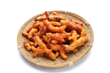 Turmeric roots on white background.