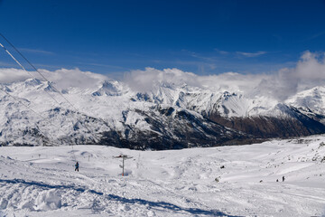 Meribel ski area on a beautiful sunny day. Valley and the Alp mountains.